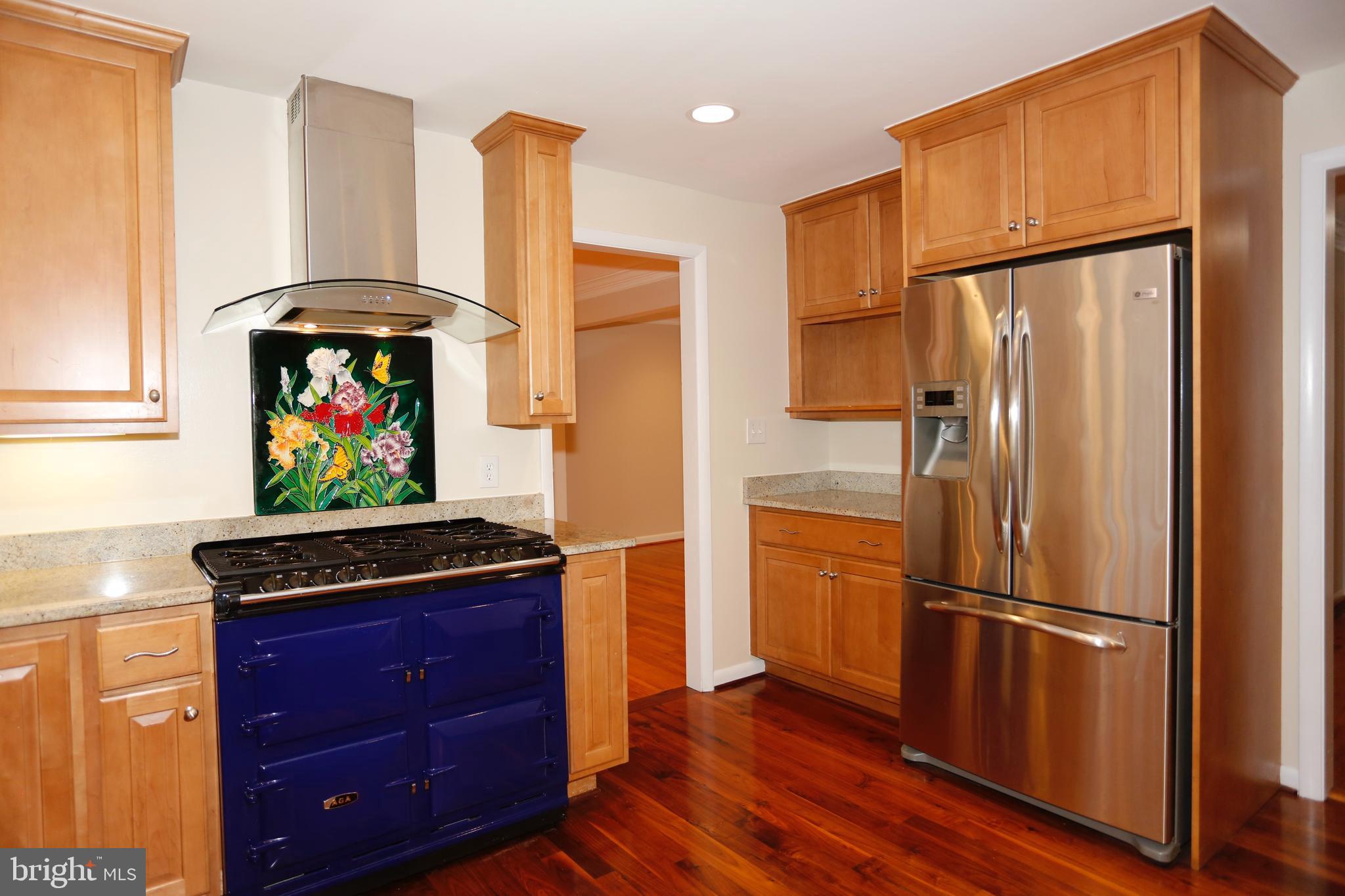 6308 Marywood Road Bethesda, MD 20817 - Photo 12 of 30 a kitchen with stainless steel appliances a refrigerator and a stove top oven