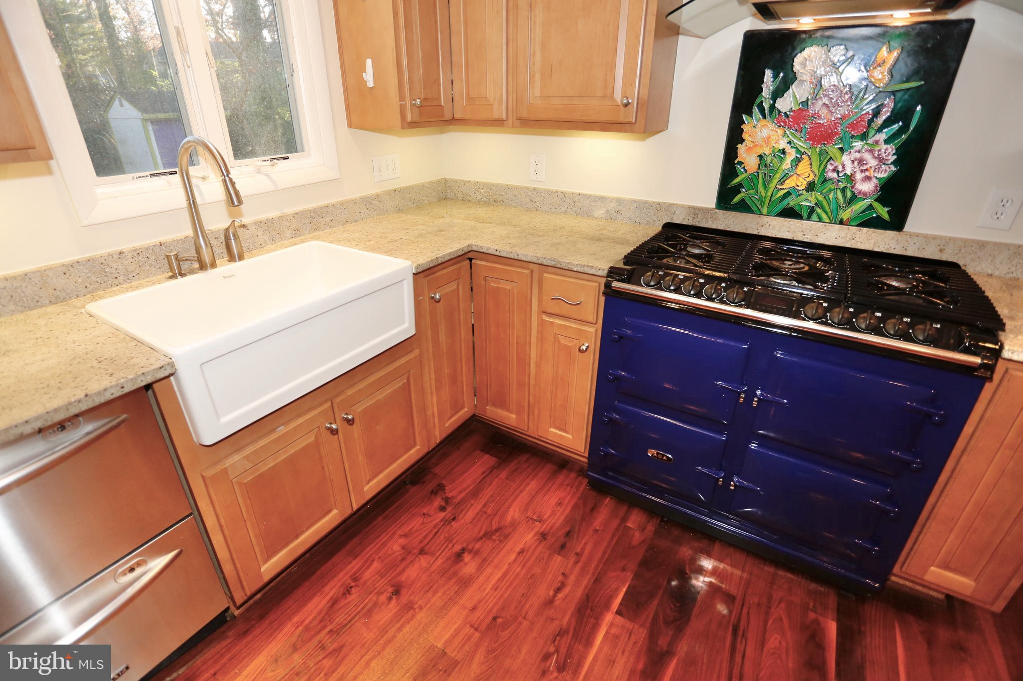 6308 Marywood Road Bethesda, MD 20817 - Photo 13 of 30 a kitchen with wooden floors and a stove top oven