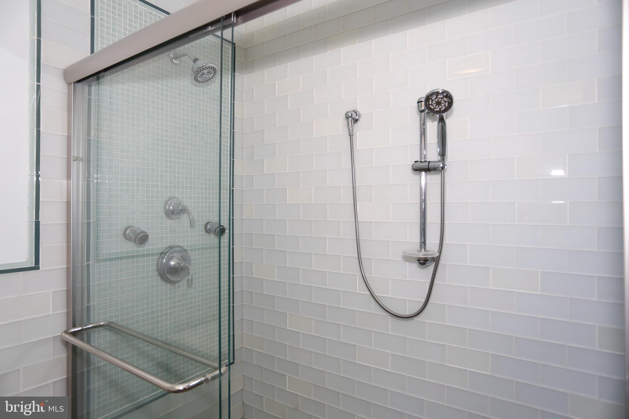 6308 Marywood Road Bethesda, MD 20817 - Photo 21 of 30 a bathroom with a glass shower door