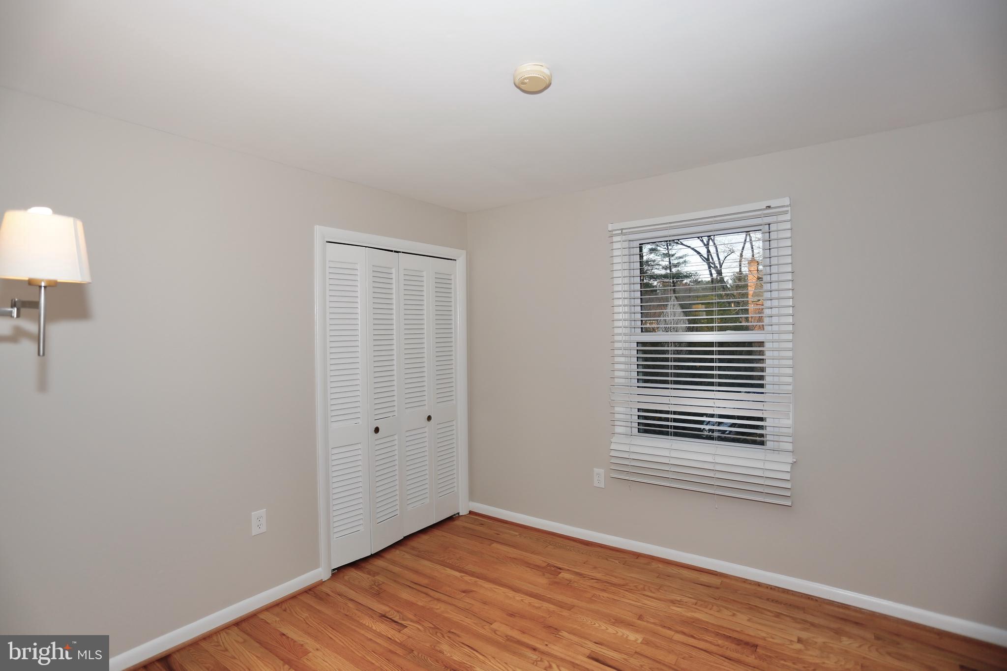 6308 Marywood Road Bethesda, MD 20817 - Photo 23 of 30 a view of an empty room with wooden floor and a window