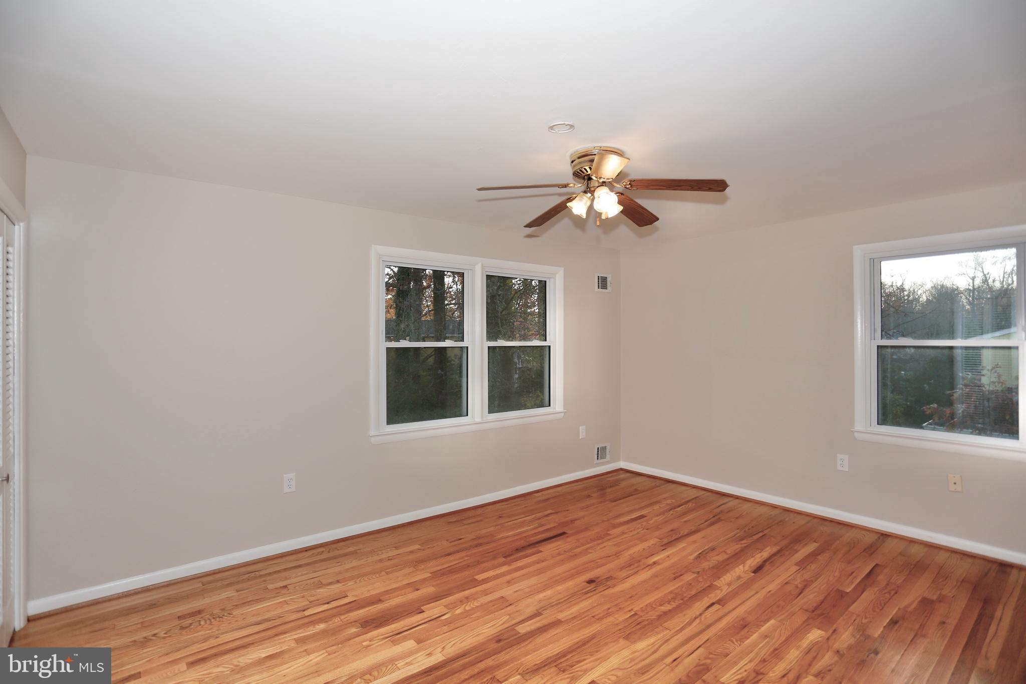 6308 Marywood Road Bethesda, MD 20817 - Photo 24 of 30 wooden floor in an empty room with a window