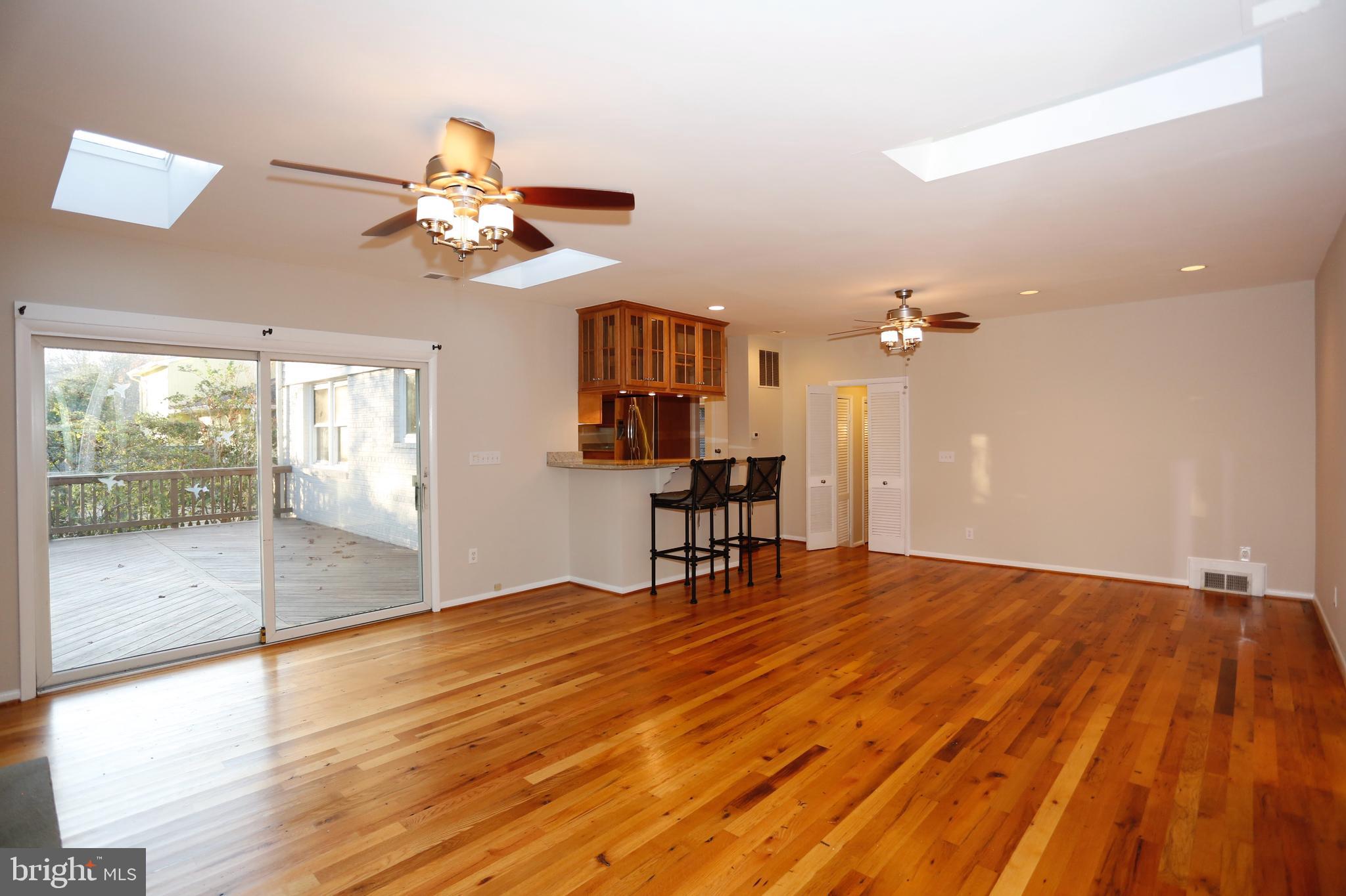 6308 Marywood Road Bethesda, MD 20817 - Photo 8 of 30 a view of a room with wooden floor and ceiling fan