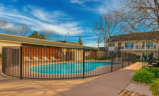 a view of a brick house with a large window