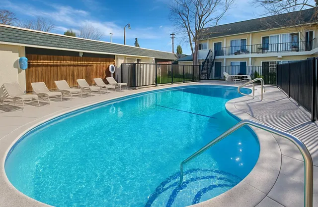 a view of a swimming pool with a patio