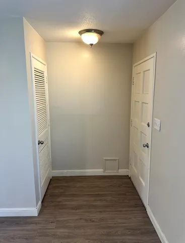 a view of room with hardwood floor