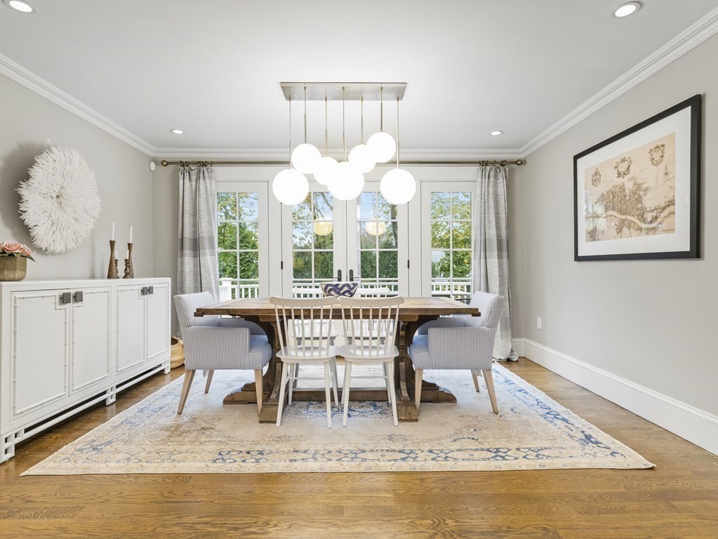 16 Clifton Road Wellesley, MA 02481 - Photo 3 of 32 a dining room with wooden floor and a floor to ceiling window