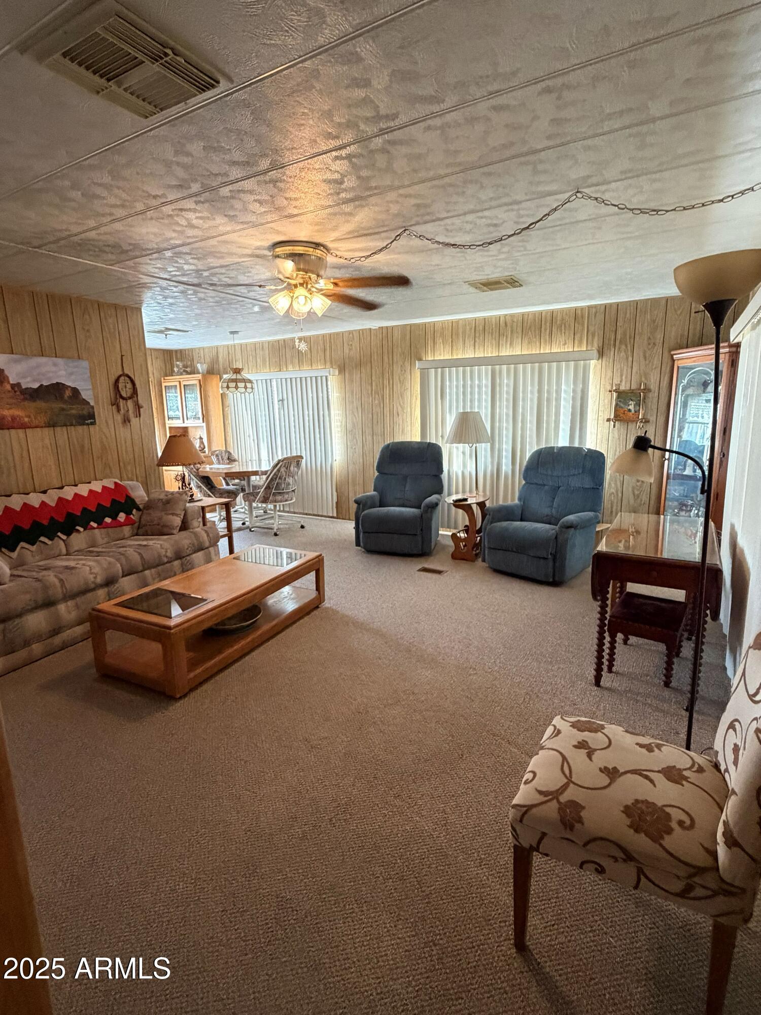 939 North Acacia Road, Unit 25 Apache Junction, AZ 85119 - Photo 11 of 25 a living room with furniture and a large window