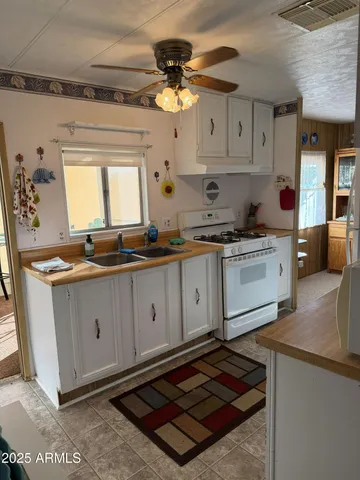 a bed sitting in a bedroom next to a bathroom