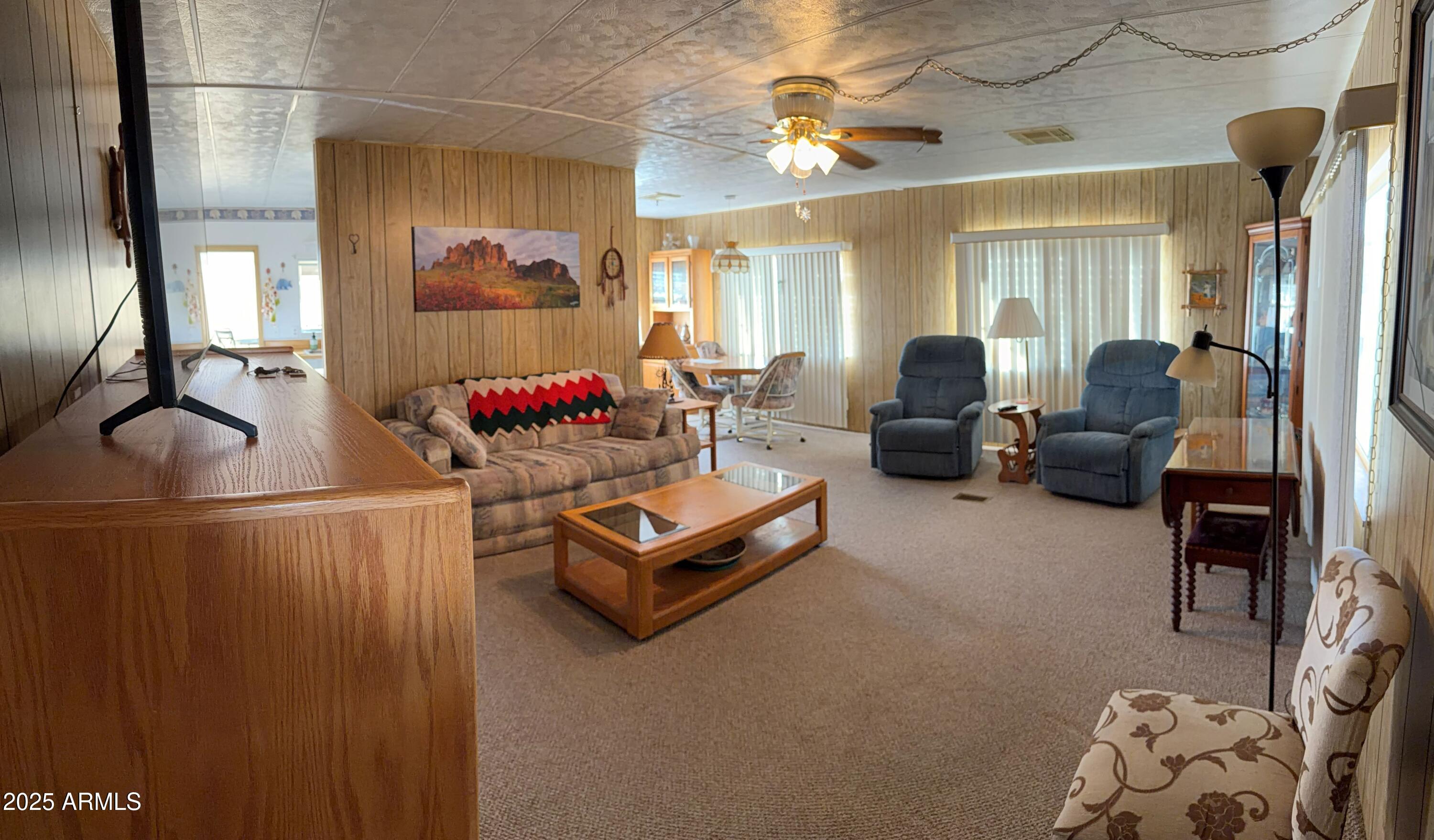 939 North Acacia Road, Unit 25 Apache Junction, AZ 85119 - Photo 9 of 25 a living room with furniture and wooden floor
