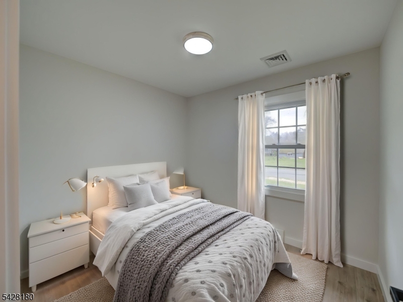 13 Fillmore Street Washington, NJ 07882 - Photo 16 of 21 a bedroom with a bed and a window