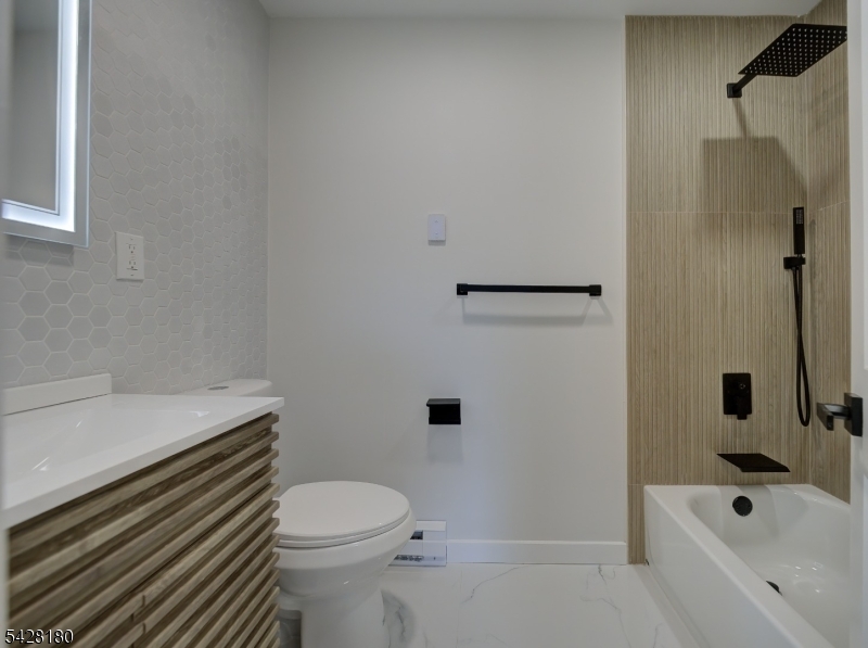 13 Fillmore Street Washington, NJ 07882 - Photo 17 of 21 a bathroom with a sink a toilet and shower