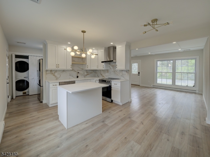 13 Fillmore Street Washington, NJ 07882 - Photo 5 of 21 a large kitchen with cabinets wooden floor and stainless steel appliances
