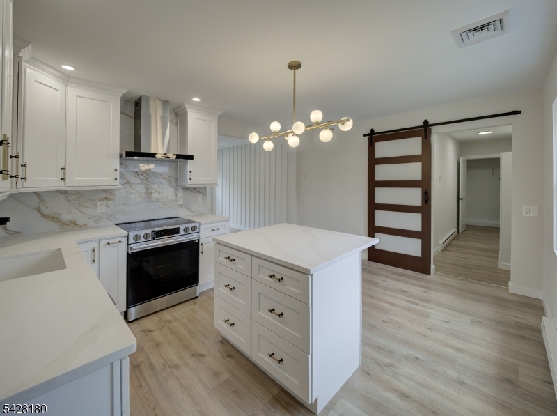 13 Fillmore Street Washington, NJ 07882 - Photo 6 of 21 a kitchen with a stove and a sink