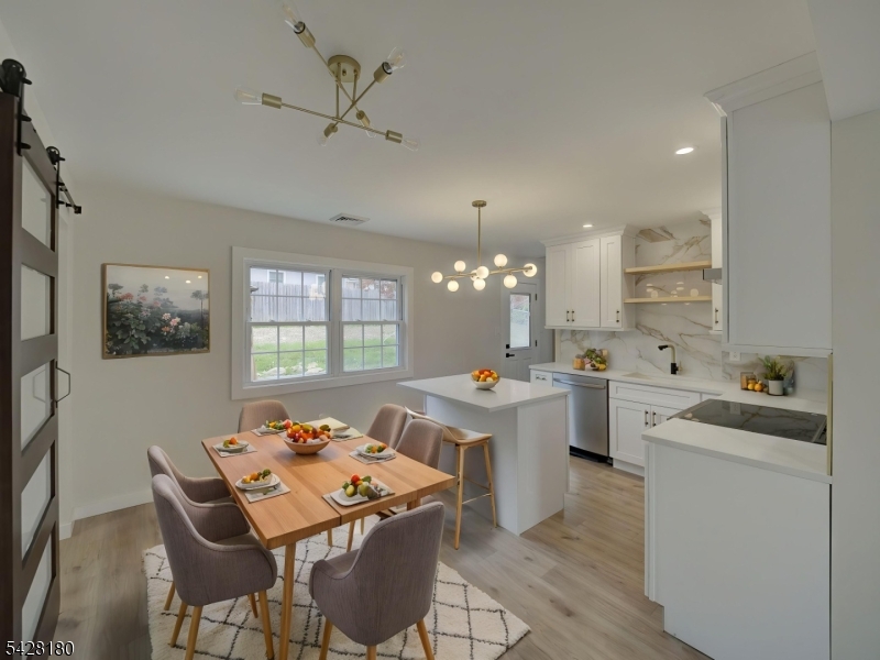13 Fillmore Street Washington, NJ 07882 - Photo 9 of 21 a view of a dining room with furniture and chandelier