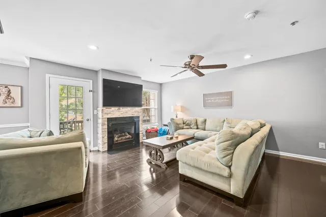 a living room with furniture fireplace and a flat screen tv