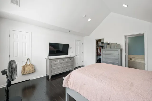 a bedroom with a bed and furniture