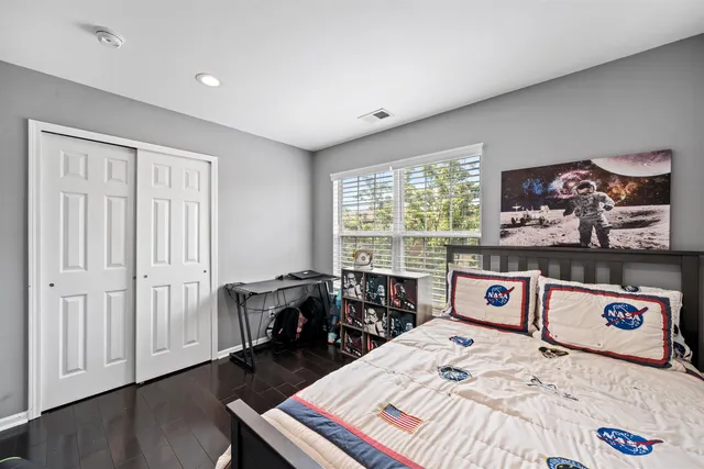 a room with a bed and a table in it