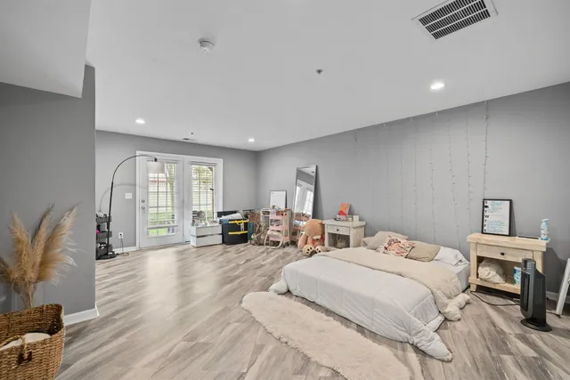 a bedroom with two beds and a couch