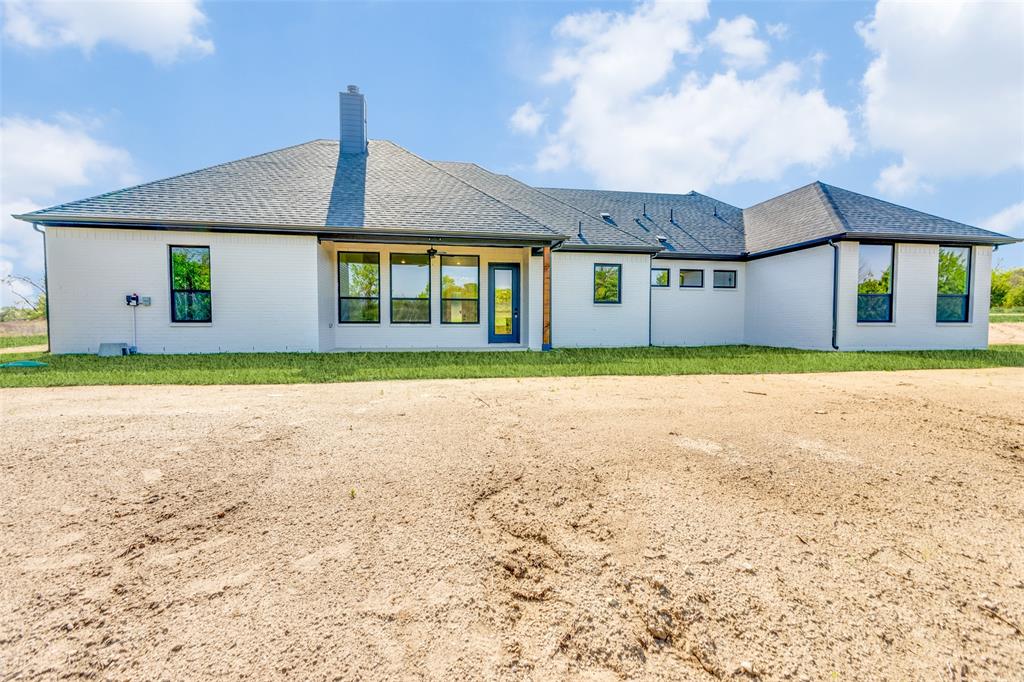 505 Aermotor Loop Weatherford, TX 76085 - Photo 15 of 17 a front view of a house with a yard