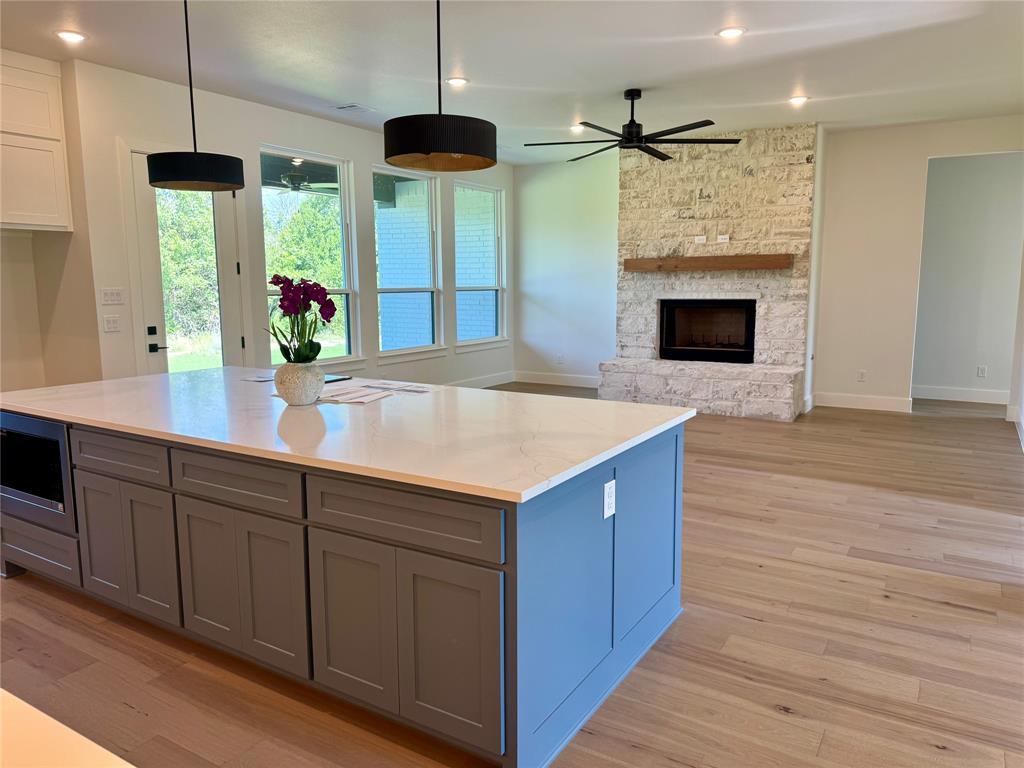 505 Aermotor Loop Weatherford, TX 76085 - Photo 7 of 17 a kitchen with stainless steel appliances a large counter top space a sink and wooden floor