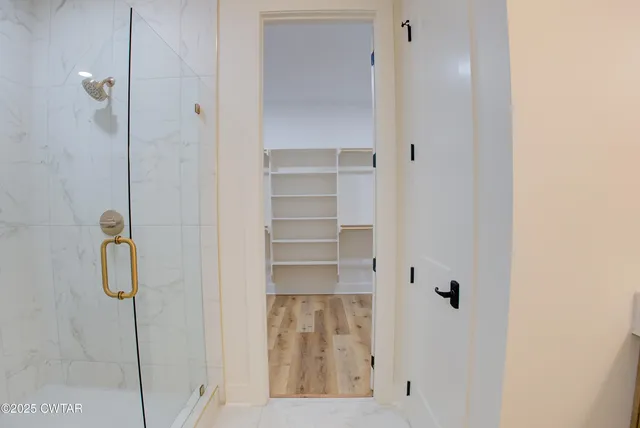 a bathroom with a sink and shower