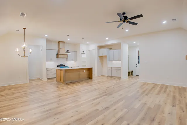 a view of kitchen with wooden floor and window