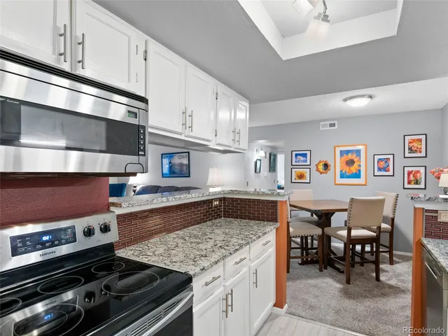 a kitchen with a stove and a sink