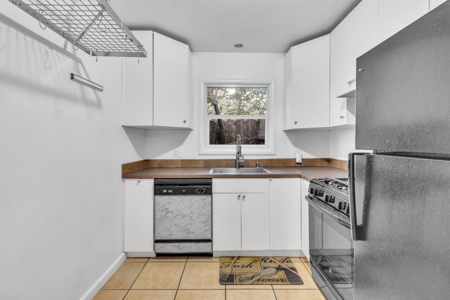 2500 Ethan Way Sacramento, CA 95821 - Photo 11 of 28 a kitchen with stainless steel appliances granite countertop a sink stove and cabinets