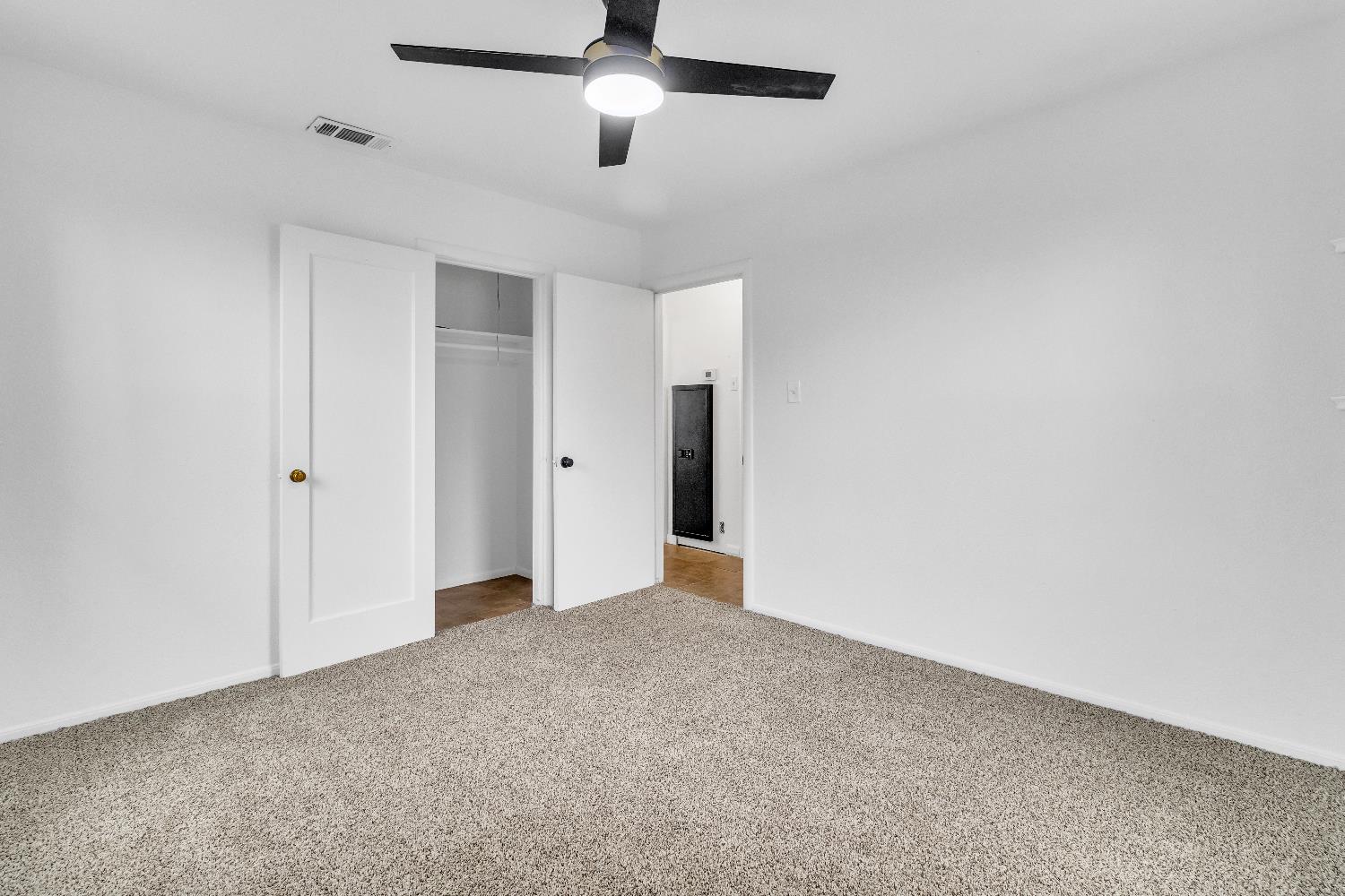 2500 Ethan Way Sacramento, CA 95821 - Photo 13 of 28 an empty room with closet area and fan