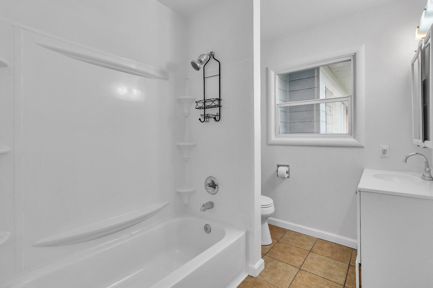 2500 Ethan Way Sacramento, CA 95821 - Photo 16 of 28 a bathroom with a bathtub sink and toilet