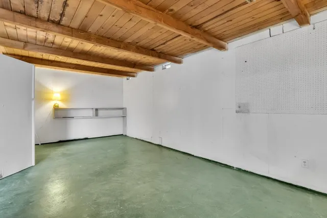 a view of a room with cabinet and windows