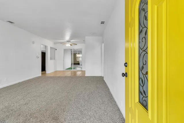 a view of a bathroom with a tub and shower