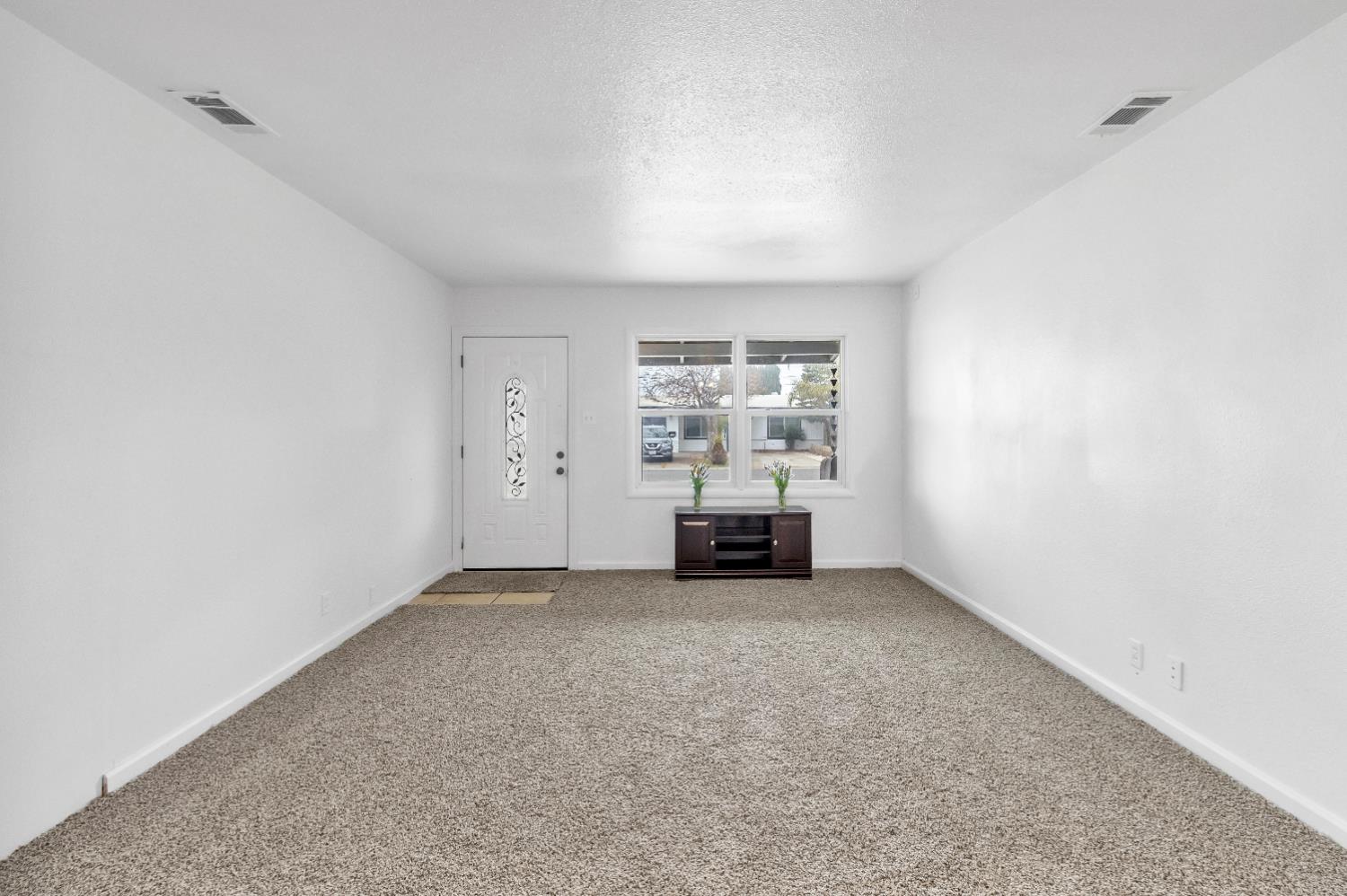 2500 Ethan Way Sacramento, CA 95821 - Photo 8 of 28 an empty room with fireplace and view