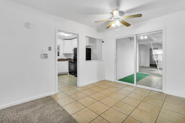 a view of a livingroom with a kitchen