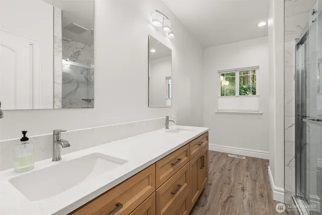 a bathroom with a sink and a mirror