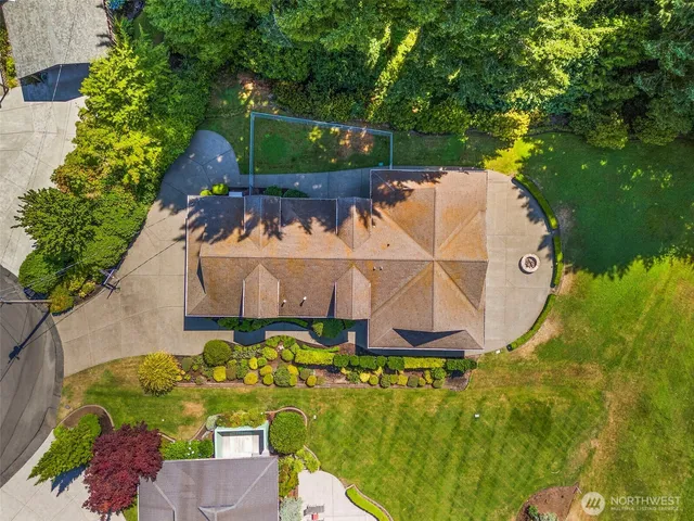 an aerial view of a house with a garden