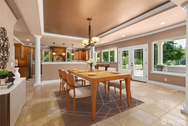 a dining room with furniture and window