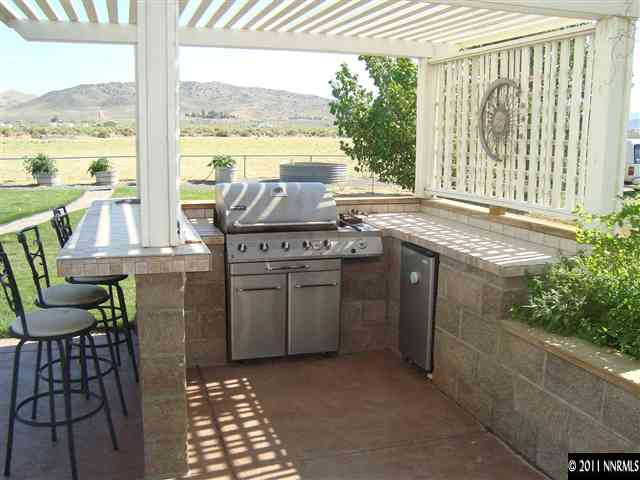 a kitchen with a stove a sink and cabinets