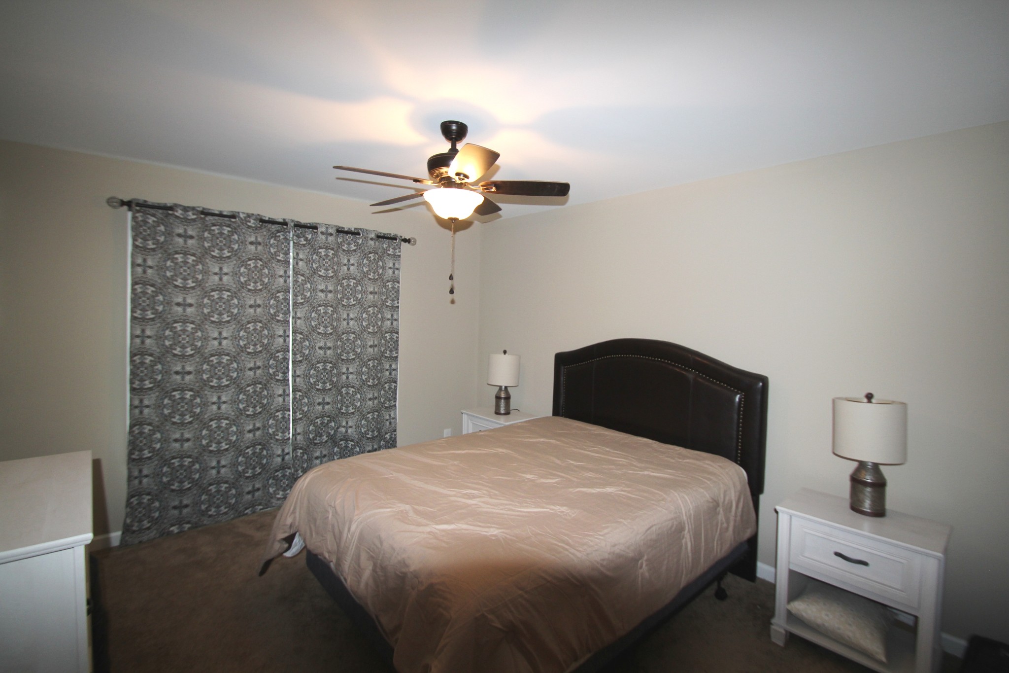 406 Spring Meadows Lane Morrison, TN 37357 - Photo 9 of 13 a bedroom with a bed and a chandelier