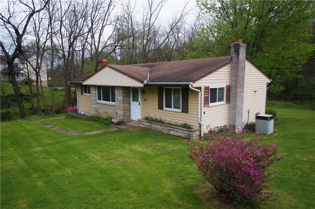 284 Mansfield Road Washington, PA 15301 - Photo 2 of 25 A cozy stone faced ranch home, with beautiful hardwood floors, fresh interior paint, multi pane windows and 3 garages total!