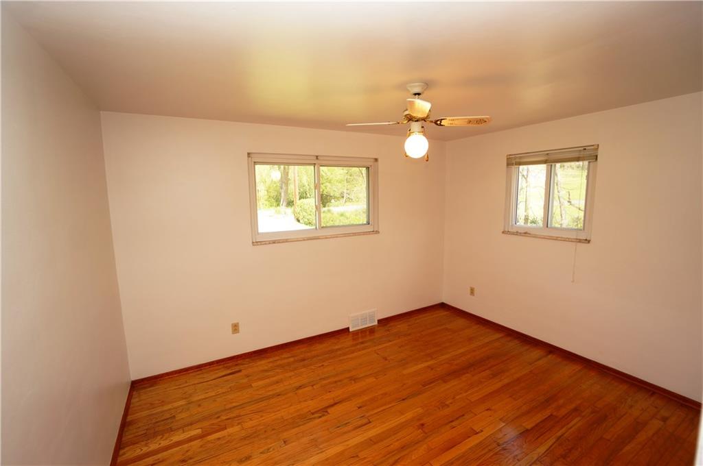 284 Mansfield Road Washington, PA 15301 - Photo 16 of 25 master bedroom features two windows, ceiling fan, 6' closet & faces the front of the home