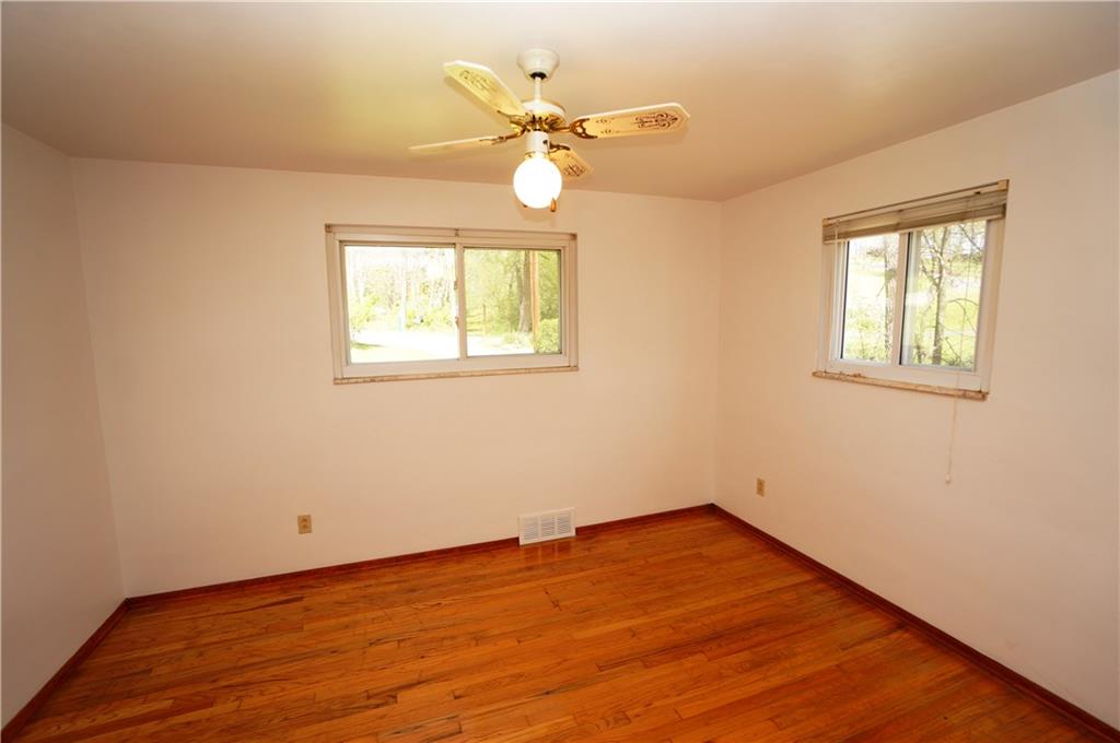 284 Mansfield Road Washington, PA 15301 - Photo 20 of 25 This is the rear bedroom, which could also be used as a master. It too has 2 windows, 6' closet and ceiling fan