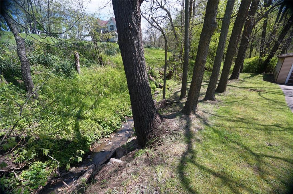 284 Mansfield Road Washington, PA 15301 - Photo 24 of 25 Small gurgling creek runs beside the house...is lovely to look at...who needs to add a man made pond in your yard when you have this?