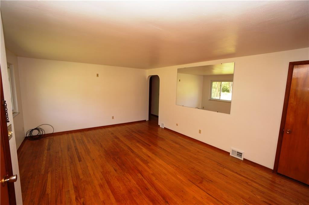 284 Mansfield Road Washington, PA 15301 - Photo 8 of 25 living room features coat closet, large mirror on wall...and lots of room