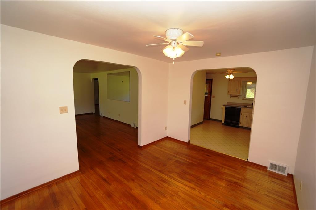 284 Mansfield Road Washington, PA 15301 - Photo 10 of 25 Dining room measures 12x10' m/l features 2 windows, ceiling fan, hardwood floors and arched doorways.