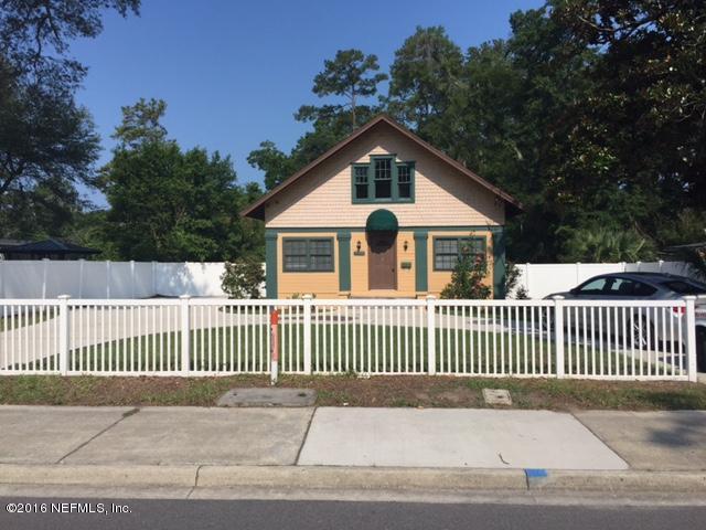3308 St Augustine Road Jacksonville, FL 32207 - Photo 1 of 21 a view of a house with a small yard and wooden fence