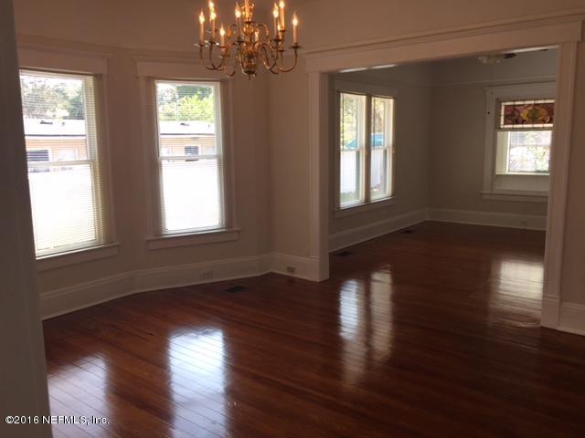 3308 St Augustine Road Jacksonville, FL 32207 - Photo 11 of 21 a view of empty room with wooden floor and fan