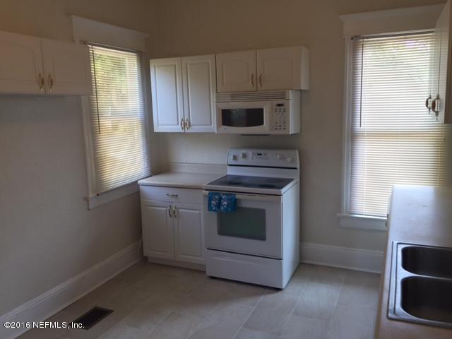 3308 St Augustine Road Jacksonville, FL 32207 - Photo 12 of 21 a kitchen with stainless steel appliances a stove a microwave and window