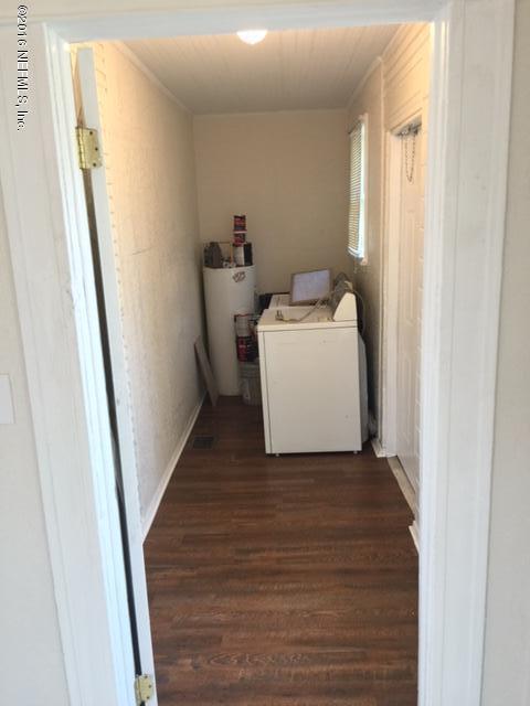 3308 St Augustine Road Jacksonville, FL 32207 - Photo 14 of 21 a utility room with wooden floor washer and dryer