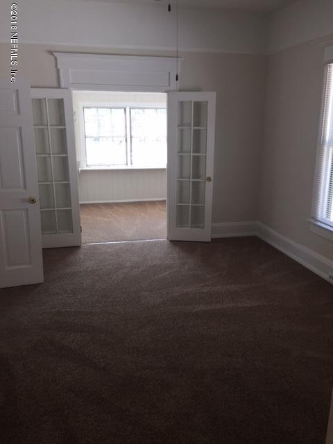 3308 St Augustine Road Jacksonville, FL 32207 - Photo 8 of 21 an empty room with windows
